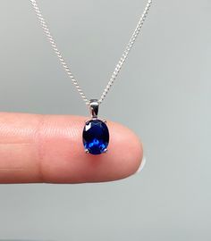 Small Sterling Silver Blue Sapphire CZ Pendant Necklace Simple Necklace/Minimalist Necklace/Elegant Necklace  Dainty and Petite Necklace Perfect For Everyday Wear September Birthstone Necklace  Metal: All components are made from solid .925 Sterling Silver  Stone: Cubic Zirconia Stone size: 8mm x 6mm Pendant Measurement: 13mm x 6mm Choose Chain Length At Checkout  You can find other CZ and Birthstone Jewelry in my shop here   https://www.etsy.com/shop/LinksAndStones?ref=seller-platform-mcnav&section_id=24399452 Please feel free to Convo me with any questions before purchasing.  Please view policy before purchasing Thank You For Visiting My Shop NK0-12 Oval Sapphire Stone Jewelry, Oval Sapphire Jewelry With Stones, Blue Oval Pendant Necklace With Birthstone, Blue Oval Birthstone Necklaces, Blue Birthstone Necklace With Oval Pendant, Blue Oval Birthstone Necklace, Blue Oval Gemstone Necklace, Sapphire Birthstone Necklace With Oval Pendant, Sapphire Necklace Simple