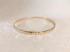 "The rings color in the picture is slightly different to the actual color. Gold Filled is displayed as \"Jewelry Gold\". Please do not compare to your existing rings. We cannot guarantee our rings' color will be exactly matched the color of your other existing rings. All bangle bracelet are tailor-made according to the size requested by the customer. No returns or exchanges Fast Processing Time: It will take me 1 -2 days to ship out your item. Details : - Width: 3.8 mm, Due to hand-made, the wid Handmade Gold Bangle Bracelet For Everyday, Hypoallergenic Gold Round Bangle, Hypoallergenic Gold Bangle, Dainty Stackable Round Bangle, Hypoallergenic Yellow Gold Bangle Bracelet, Handmade Round Bangle For Everyday, Everyday Handmade Bangle, Dainty Handmade Gold Bangle Bracelet, Dainty Handmade Gold Bracelet