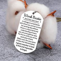 two white cotton balls sitting next to each other with a poem on the tag that says work beside them