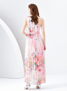 Beguiling in its ethereal beauty, this sleeveless maxi dress is a masterpiece of artful prints and soft, flowing fabric. The whimsical pattern evokes a dreamlike cityscape, enriched with vibrant splashes of color that mimic the transient beauty of a sunset skyline. The high neckline is graced with delicate ruffles, lending a romantic air to the overall design. A sash cinches the waist, offering a flattering silhouette, while the lightweight material dances around the ankles, perfect for an eveni Garden Soiree, Flowing Fabric, Flounce Skirt, Dress Sleeve Length, Floral Patchwork, Full Length Skirts, Sleeveless Dresses, Ethereal Beauty, Printed Dress