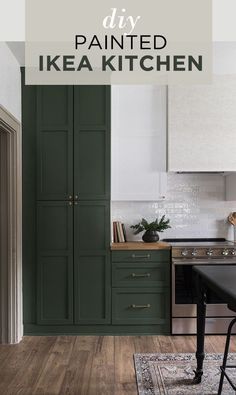 a kitchen with dark green cabinets and white walls, an area rug on the floor