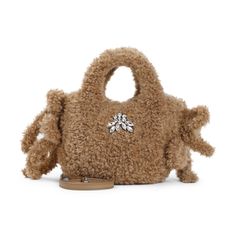 Soft faux fur Simone Rocha tote bag showcases a luxurious texture with a crystal embellishment at the front. The tonal handle and side bow add playful elegance, while a detachable leather shoulder strap provides versatility for various occasions.

- Faux fur material
- Crystal embellishment
- Tonal handle
- Side bow detail
- Detachable leather shoulder strap

- Dimensions: W:21cm  H:15cm D:11cm Stone Island Shadow Project, Faux Fur Material, Influential Women, Brown Handbag, Valentino Bags, Mini Tote, Crystal Embellishment, Tory Burch Shoes, Bow Detail