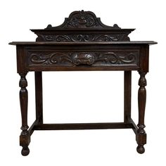 an old wooden table with carvings on the top and bottom shelf, against a white background