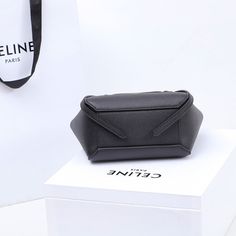 Size: 15cm*13cm*9cm It comes with Dust box, Care manual, Tag, and Paper bag. Designer Large Capacity Box Bag For Gift, Modern Rectangular Shopping Pouch, Elegant Belt Bag With Removable Pouch For Shopping, Modern Top Handle Box Bag As Gift, Black Top Handle Box Bag For Gift, Black Top Handle Box Bag As Gift, Modern Top Handle Pouch For Gift, Modern Top Handle Pouch As Gift, Square Box Bag With Top Carry Handle For Gift