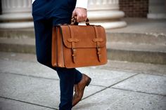 This handcrafted men's leather briefcase was inspired by vintage lawyer briefcases from decades ago. Made of full grain leather that's rich in character and solid antique brass hardware, this bag is built to last. Read the story behind the Esq. Briefcase below. Classic Vegetable Tanned Leather Briefcase For Travel, Classic Travel Briefcase In Vegetable Tanned Leather, Classic Oiled Leather Satchel Briefcase, Classic Vegetable Tanned Leather Bag For Office, Classic Vegetable Tanned Leather Office Bag, Classic Office Bag In Vegetable Tanned Leather, Classic Brown Vegetable Tanned Leather Briefcase, Classic Oiled Leather Briefcase For Travel, Classic Oiled Leather Rectangular Briefcase