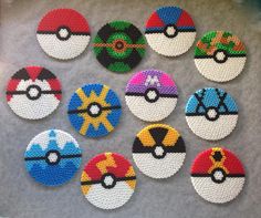 six different types of pokeballs are shown on a gray surface with white and black dots