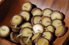 small candles are placed in a wooden box