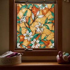 a stained glass window with flowers on it