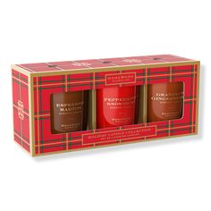 three candles in a gift box with red and green plaid wrapping on the packaging side