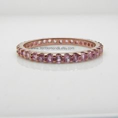 Pink Sapphire Eternity Ring Rose Gold Plated over by 360Diamonds Rose Gold Pink Sapphire Stackable Rings For Anniversary, Rose Gold Stackable Rings With Pink Sapphire For Anniversary, Anniversary Rose Gold Stackable Rings With Pink Sapphire, Elegant Rose Gold Stackable Rings With Pink Sapphire, Rose Gold Pink Sapphire Round Cut Jewelry, Rose Gold Cubic Zirconia Sapphire Ring With Prong Setting, Rose Gold Ring With Pink Sapphire, Anniversary Rose Gold Pink Sapphire Ring, Rose Gold Round Sapphire Cubic Zirconia Ring