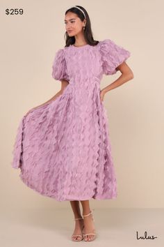 Bring a sweet and whimsical sense of fun to all your occasions in the Sister Jane Roundup Lilac Ruffle-Textured Puff Sleeve Midi Dress! Lightweight woven fabric (with a dreamy, three-dimensional ruffled effect throughout) shapes short, ultra-adorable puff sleeves with elastic at the cuffs. Crew neckline tops a princess-seamed bodice that has a flattering, fitted waist thanks to twin sets of slender ties that wrap the bodice and tie at the back. Gathered side panels lend the perfect amount of volume to the A-line skirt, which ends at a midi hem. Hidden zipper at back. Fit: This garment fits true to size. Length: Mid-calf length. Bust: Works best for A to C cup sizes - consider sizing up for fuller bust. Waist: Not Fitted - comfortable room throughout midsection. Hip: Not Fitted - fuller ski Puff Sleeve Midi Dress, Sister Jane, Sisters Dress, Cup Sizes, C Cup, Comfortable Room, Puff Sleeve Dresses, Sleeve Midi Dress, Side Panels