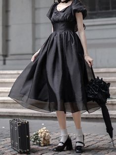 Step into elegance with our black boned high waist dress, a timeless piece that exudes sophistication and grace. Inspired by the iconic style of Audrey Hepburn, this little black dress features a flattering high waist and delicate puff sleeves, adding a touch of feminine charm to the classic silhouette. Crafted with attention to detail, the boned structure provides a structured and tailored fit, ensuring a refined look for any occasion.   Please note that this product includes only one dress. Garment Size SizeSMLXLShoulders35363738Bust84889296Sleeve Length20.7 2121.321.6Waist66707478Full Length106107.5109111.5 Black Square Neck Corset Dress For Summer, Black Square Neck Corset Dress For Spring, Black Corset Dress With Fitted Bodice And Square Neck, Black A-line Midi Dress With Fitted Bodice, Black Fit And Flare Dress With Full Skirt, Black Corset Dress For Cocktail With Fitted Bodice, Black Square Neck Corset Dress For Evening, Black Fit And Flare Corset Dress For Party, Black Full Skirt Midi Dress For Summer