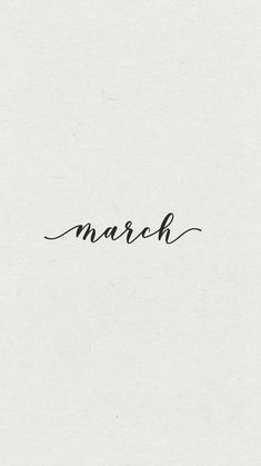 the word march written in cursive ink on a white paper with black writing