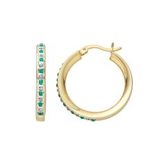 Add a sleek, modern look to your jewelry collection with these hoop earrings. These 18k gold-over-sterling silver earrings feature alternating emerald stones and diamond accents that are sure to dazzle. Brighten your look with these stunning hoop earrings.Add a sleek, modern look to your jewelry collection with these hoop earrings. These 18k gold-over-sterling silver earrings feature alternating emerald stones and diamond accents that are sure to dazzle. Brighten your look with these stunning ho Gold Emerald Jewelry With Channel Set, Hoop Earrings For Anniversary With May Birthstone, May Birthstone Small Hoop Earrings For Anniversary, Anniversary Hoop Earrings With May Birthstone, Elegant Hoop Huggie Earrings With Birthstone, Yellow Gold Hoop Earrings With Birthstone, Elegant Birthstone Huggie Hoop Earrings, Green Small Hoop Huggie Earrings For Anniversary, Anniversary Huggie Earrings With May Birthstone