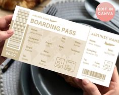 a person holding up a boarding pass on a plate