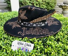 Jelly Roll, Save Me *Vegan Suede Custom Burned Hat Personalization is free (name, short quote, date, small butterfly, etc.) Adjustable to fit large heads down to children size.   All hats come with a band and feather.  Priority Shipping with $100 Insurance. Please allow 2-3 weeks for delivery. These are handmade and in high demand.  If you need it sooner, please message me and I will try to accommodate you. Burned Hats, Custom Cowboy Hats, Short Quote, Small Butterfly, Fire Designs, Yee Haw, Jelly Roll, Wild Child, Kids Hats