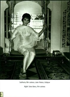 a black and white photo of a woman sitting on a swing