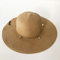 Nwt Juicy Couture Woven Floppy Sun Beach Straw Hat With Goldtone Chain & Charms. New With Tags. A Tan/Beige Straw Hat With Gold Chains And Charms To Accent The Band. Nice Wide Brim To Protect You From The Sun. Add A Little Glam And Bling To The Beach Or Pool. Great Deal On Shipping When You Buy This Item (Which Will Need A Larger Box For Shipping) On Poshmark Hat Jewelry Accessories, Elegant Gold Sun Hat For Vacation, Chic Adjustable Gold Straw Hat, Adjustable Gold Chic Straw Hat, Gold Brimmed Sun Hat For Vacation, Gold Brimmed Sun Hat For Beach, Gold Brimmed Beach Hats, Adjustable Gold Straw Hat For Vacation, Adjustable Gold Sun Hat For Summer