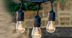 several light bulbs are hanging from a chandelier