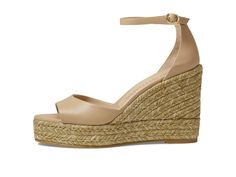 A braided detailing adorns the Stuart Weitzman® Nudistcurve Espadrille Wedge Heels. This pair comes with the signature brand detailing on the insole..Leather upper..Leather lining and insole..Ankle strap with buckle closure..Wedge heels..Slip-on style..Rubber outsole..Made in Spain..Product measurements were taken using size 9, width B. Please note that measurements may vary by size..Measurements: Heel Height: 4 in Weight: 15 oz Platform Height: 1 1/4 in Elegant Closed Toe Wedge Sandals With Woven Sole, Elegant Wedge Sandals With Woven Sole And Ankle Strap, Elegant Straw Platform Wedge Sandals, Espadrille Wedge, Stuart Weitzman Shoes, Espadrilles Wedges, Personal Shopping, Pharmacy Gifts, Platform Wedges