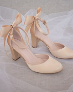 An all-time classic and elegant style with simplicity of satin heels with a satin back bow.DETAILS:HEEL HEIGHT: 3 inchesCOLORS AVAILABLE: Champagne, White, Ivory, Navy, Burgundy, and Light BlueUPPER: Synthetic upper and liningMATERIALS: Mandmade outsoleSTYLE NAME: SARAH Champagne Bridal Shoes, Champagne Block Heels, Wedding Shoes Champagne, Beige Heels Aesthetic, Champagne Shoes Heels, Creme Heels, Shoes For Dresses, Fancy Shoes For Women, Grad Heels