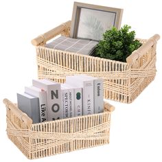 two wicker baskets with books in them and a picture frame on the top one