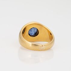 This is part of Chairish’s Fine Jewelry assortment.  Stylish vintage natural Ceylon sapphire signet ring (circa 1990s) crafted in 18 karat yellow gold.   Oval mixed cut natural sapphire measures 8.5mm x 7.8mm x 6.6mm (estimated at 3.50 carats). The sapphire is medium blue in colour, lightly included, good cut and bezel set in the centre. Colour and inclusions are typical of sapphires from Ceylon (Sri Lanka). There is no evidence of any treatments to the stone.     Included with the purchase of t Yellow Gold Sapphire Signet Ring With Polished Finish, Formal Yellow Gold Domed Sapphire Ring, Classic Domed Yellow Gold Sapphire Ring, Classic Yellow Gold Domed Sapphire Ring, Yellow Gold Domed Sapphire Ring, Domed Gemstone Signet Ring For Anniversary, Anniversary Domed Signet Ring With Gemstone, Formal Yellow Gold Signet Ring With Birthstone, Anniversary Yellow Gold Sapphire Signet Ring