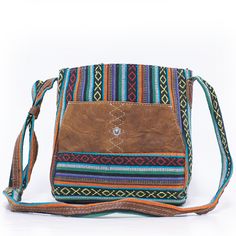 A Truly Unique Cross Body Bag The Aria Cross Body is a mid-size Nepali bag made with woven cotton and buffalo leather. Each bag's material is cut and applied differently for a one-of-a-kind statement piece. The Aria features a long adjustable strap to be worn across the body or over the shoulder. A button snap closure fastens the main pocket. The interior is cotton lined with a small zippered security pocket to keep your valuables close. Add the Aria Cross Body for a unique addition to your bag Eco-friendly Woven Crossbody Shoulder Bag, Brown Cotton Shoulder Bag With Leather Handles, Multicolor Canvas Crossbody Shoulder Bag, Brown Cotton Shoulder Bag, Bohemian Canvas Hobo Bag For Travel, Brown Rectangular Cotton Hobo Bag, Rectangular Brown Cotton Hobo Bag, Casual Handwoven Leather Bag, Multicolor Canvas Hobo Bag With Adjustable Strap