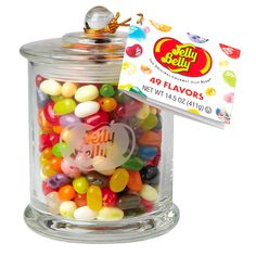 a glass jar filled with jelly beans and a tag on the lid that says jelly belly