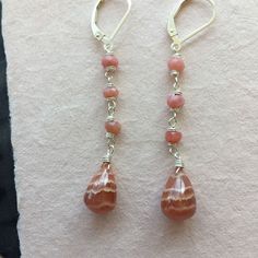 I found some SUPER COOL Rhodocrosite recently and this is one of 3 pairs of these teardrops I purchased. I have wired them with faceted pink opals on sterling silver wire on sterling silver earrings. Please choose your earwire preference as some styles are upgrades from the basic French hook style. The approximate length is 2 1/8". Your jewelry will arrive beautifully giftboxed. Stack Earrings, Basic French, Stacked Earrings, Colorful Jewelry, Pink Opal, Silver Wire, Super Cool, Gemstone Earrings, Jewelry Crafts