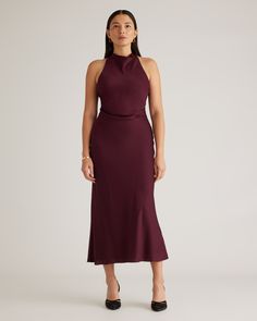 A new capsule must: our Washable Stretch Silk High Neck Midi Dress. Designed with a classic high neck and a flattering silhouette, this dress is cinched at the waist with crossed shoulder straps in the back. Like all of our silk, it’s washable, hypoallergenic, and thermoregulating to keep you comfortable.  | Quince | Women's Washable Stretch Silk High Neck Midi Dress in Wine Tasting, Size XS, Mulberry Silk Wedding Dress Code Guide, Wardrobe Color Guide, Dress Code Guide, Wine Colored Dresses, Beautiful Cocktail Dresses, Winter Wedding Guest Dress, High Neck Midi Dress, Wine Dress, Halter Midi Dress