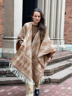 Caramel brown Open cape poncho for women and men Caramel Merino wool blanket poncho Warm Wrap Shawl Cape Poncho Open Front Cardigans brown One size fits fashionably for most everyone, short or tall, big or small. This piece is versatile for both Men's & Women's outdoor fashion, and can be used insider in cooler winter weather to keep warm while reading on the couch. CARE: Hand-wash and hang to dry, light iron if needed, or dry clean. MEASURES: Length at the front of the neckline to the bottom is