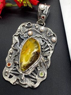 "Hand-made Sterling Silver 925 Stones used: Baltic Amber, Pearls, Peridot, Garnet Height - 3 3/8\" (with bail), Width - 1 3/4\" Unique Handcrafted One-of a-kind Design Pendant Each Piece of Jewelry in my Collection is Absolutely One of a Kind! When you start wearing a piece of my jewelry you will fall in love with it more and more each day and feel that good Energy and Love that I pass into it while creating this piece of Art. A piece of Art created for you to be inspired and love it through all Gemstones Pendant, Fossil Ring, Artisan Jewelry Handmade, Amber Gemstone, Gift For Woman, Silver Work, Beauty Ideas, Lost Wax, Unique Gemstones