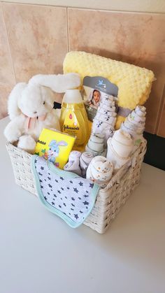 a basket filled with baby items sitting on top of a counter