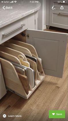 an appliance that is displaying the contents of kitchen cabinets and utensils