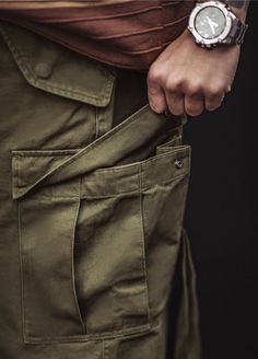 Looking for pants that are as tough as you are? Meet our American Retro M51 Multi-Pocket Military Tactical Men's Trousers! These bad boys aren't just about style—they're about functionality too. Made from 100% cotton, these trousers are built to last. Say goodbye to flimsy, cheaply-made pants and hello to durability you can count on. Whether you're tackling a DIY project or exploring the great outdoors, these pants have got your back. With their loose fit and middle waist design, these trousers Khaki Techwear Pants With Pockets, Techwear Khaki Pants With Side Pockets, Techwear Khaki Bottoms With Pockets, Khaki Combat Parachute Pants With Pockets, Combat Cotton Bottoms With Multiple Pockets, Combat Style Cotton Bottoms With Pockets, Cotton Combat Bottoms With Multiple Pockets, Khaki Parachute Pants With Belt Loops For Outdoor Activities, Khaki Parachute Pants With Belt Loops For Outdoor