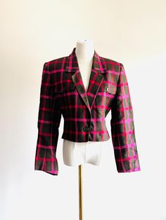 Incredible and chic cropped Anne Klein II blazer Muted pink and red plaid on a warm rich brown perfect for spring or fall 100% linen with storm structure ls shoulder  Single button closure  In amazing vintage condition  Anne Klein II 19.5" chest  23" sleeve  19.5" length  17" shoulders  16.5 waist Pink Cropped Fitted Blazer, Pink Fitted Cropped Blazer, Fitted Cropped Pink Blazer, Pink Cropped Blazer For Work, Pink Cropped Blazer For Workwear, Fitted Vintage Cropped Jacket For Fall, Fitted Plaid Blazer For Spring, Spring Fitted Plaid Blazer, Retro Fitted Cropped Outerwear