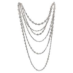 Diamonds-by-the-yard long chain necklace, featuring fine natural pear-shaped and round brilliant-cut diamonds. The diamonds are all bezel-set in polished platinum. 82 pear brilliant-cut diamonds weighing approximately 26.10 total carats and 82 round brilliant-cut diamonds weighing approximately 25.57 total carats. Diamonds altogether weighing approximately 51.67 total carats for the necklace. 66" long. Diamond Long Necklace, Diamond Chain Necklace, Black Diamond Necklace, Platinum Chain, Diamond Tennis Necklace, Fine Diamond Jewelry, Necklace Craft, Long Chain Necklace, Diamond Chain