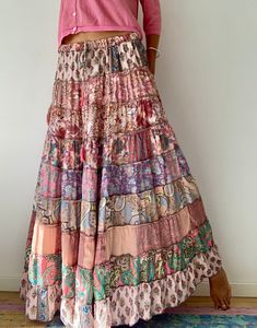 "This gorgeous colourful gypsie skirt is all fun to wear, boho style inspired long and flowy true hippy girl skirt it is made free size and floor length always one of a kind  patchwork, made of varieties of different fabrics with floral patterns,  very easy to wear and comfy  it has elasticated waist band, and will fit most of sizes S-L MEASURE One Size Fits Most length 39\"/100 cm waist 26-34\" CARE * Hand wash recommended * Hang to dry It is perfect outfit for everyday and evenings out or travels and festivals It is suitable to wear all year round with jumper and thights MATERIAL * Silk * Polyester * No lining  IMPORTANT NOTE  * Please note that colour shown on your monitor may vary from the colour of the fabric, due to light. If you have any doubts please contact us before purchuase." Flowy Hippie Maxi Skirt For Vacation, Bohemian Gathered Skirt For Summer, Spring Boho Print Maxi Skirt, Spring Hippie Maxi Dress With Flowy Skirt, Hippie Spring Flowy Maxi Dress, Spring Hippie Flowy Maxi Dress, Hippie Tiered Maxi Skirt For Vacation, Hippie Style Flowy Maxi Dress For Spring, Bohemian Flowy Maxi Skirt With Floral Print