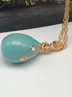 This egg pendant is a great gift for a loved one or for yourself. It is such a unique present it is made for art lovers who get inspired by beautiful things. This beautiful pendant will add charm to every outfit! Item Size: Centimeters : 1.5 x 1.5 x 2.5 Inches : 0.59 x 0.59 x 0.98 Total Length (with the chain): Centimeters: 44 Inches: 17.32 Catalog #: P720 * Each crystal is handpicked and artistically placed on the piece * Plated with 24K gold * The item is shipped in an elegant black bag. * The Novelty Lamps, Enamel Paint, Unique Presents, Art Lovers, Austrian Crystal, Black Bag, Beautiful Things, Lovers Art, Swarovski Crystals