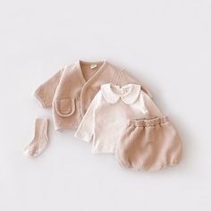 A lovely baby set of long sleeve jacket crafted from luxurious, naturally breathable cotton, paired with a matching pair of shorts.  This set is a statement piece for your little one that is easy to layer with a T-shirt, or tights and a long sleeve shirt for colder weather.   - V-neck opening with button front closure.  - Elastic waistband and leg opening.   - 100% Cotton Pair it with a Peter Pan shirt (https://etsy.me/43elU7P) and a pair of  lace socks (https://etsy.me/49MgHGN). Orders over $35 Spring Cotton Sets With Long Sleeve, Spring Cotton Long Sleeve Sets, Spring Long Sleeve Cotton Sets, Spring Matching Set With Long Sleeve, Spring Long Sleeve Matching Set, Fall Playtime Long Sleeve Sets, Cream Long Sleeve Sets For Fall, Beige Long Sleeve Set For Fall, Fall Playtime Sets With Long Sleeves