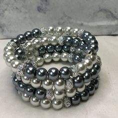 Shop renee401977's closet or find the perfect look from millions of stylists. Fast shipping and buyer protection. Lt Gray & Gray Pearl Glass Bead (8mm) Silver Resin Rondelle (4x8mm) Memory Wire Silver Plated Memory Wire Bead Ends Fits up to 6 1/2 to 8 inch Wrist The Bigger the Wrist the less layer Elegant Gray Beaded Bracelets, Elegant Gray Beaded Bracelets With Silver Beads, Elegant Silver Beaded Bracelets With Bling, Silver Beaded Bracelets With Bling, Silver Bling Beaded Bracelets, Black Metal Bracelet, Wire Bangle Bracelets, Tibetan Bracelet, Brass Cuff Bracelet