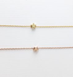 celestial jewelry, Dainty star necklace, Rose gold necklace, gold necklace, star jewelry, Layering necklace, Bridesmaid Gifts, best friend gifts, gifts for her D E T A I L S: *Shiny rose gold plated star or *matte gold plated star *Dainty cable chain, chose your perfect length *Lobster clasp closure SHIPPING: *Free domestic shipping on all orders over $35. PACKAGING: *All pieces come beautifully packaged, perfect for gift giving. Find more to ❤️ here: http://etsy.com/shop/thejewelrystandard Tiny Star Necklace, Jewelry Layering Necklace, Gifts Best Friend, Dainty Necklace Layered, Jewelry Layering, Star Necklace Gold, Necklace Star, Store Jewelry, Necklace Rose Gold