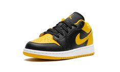 The Air Jordan 1 Low GS “Yellow Ochre” is the youth sizing of the retro basketball shoe in a black-and-yellow design.  The Jordan 1 Low “Yellow Ochre” features a yellow perforated leather toe, a yellow leather Swoosh, and a yellow leather heel tab.  Additional yellow accenting can be found on the collar and on the Jumpman branding on the tongue.  The toe, forefoot, eyelets, and mid-panel appear in black leather.  A black “Wings” logo is embroidered on the heel.  Release date: December 18, 2023 Jordan 1 Low Yellow, Retro Basketball Shoes, Retro Basketball, Yellow Design, Yellow Ochre, Wings Logo, Yellow Outfit, Black Wings, Stadium Goods