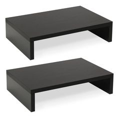 two black coffee tables sitting next to each other