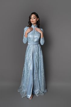 Fitted Evening Kaftan For Eid, Fitted Floor-length Kaftan For Evening, Fitted Floor-length Evening Kaftan, Elegant Blue Floor-length Kaftan, Elegant Fitted Blue Abaya, Luxury Wedding Abaya For Eid, Elegant Light Blue Dress For Reception, Light Blue Floor-length Dress For Eid, Light Blue Dress For Wedding And Eid