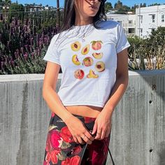 This Vintage Peach Baby Tee is the perfect addition to your summer closet!   About Product: 👕 100% ethically grown and harvested midweight US cotton that feels soft to the touch and a great choice for any season. 👕 Please not that these shirts are tight.  Size up 1-2 sizes for a more relaxed fit. 👕 Check size chart for accurate sizing 📦 Tracking number provided once item is shipped. There are no returns or exchanges due to the made-to-order nature of this product. 🚚 Orders are typically pro Aesthetic Peach, Y2k Graphic Tees, Peach Graphic, Fruit Shirt, Peach Shirt, Orange Tees, Summer Closet, Shirt Aesthetic, Boho Shirt