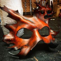 A great mask for any costume wearing event! And remember when your not wearing it, it can be hung on the wall as some awesome wall art! Each one is handmade and hand dyed by me. Due to being handmade no two will be the same. Color and shape will differ slightly. Made per order Made with: Leather Eco-Flo Dyes and Finishers Adjustable! It ties up with  leather laces. Will fit most faces and heads Ships worldwide! Bark Mask, Leather Mascarade Mask, Autumn Masquerade Mask, Wood Mask Fantasy Art, Cool Leather Mask, Mighty Oaks, Handmade Costumes, Leather Leaf, Leather Mask