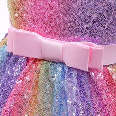 Your pretty little princess is sure to love this sleeveless Rainbow Sequins Princess Dress with its fluffy tulle tutu pink skirt and bow. Ideal for unicorn party rides and sparkly rainbow tea parties. Rainbow Sequins Princess Dress Details: Style: Sleeveless Tutu Dress Silhouette: Ball Gown Age Range: 9 months - 10 years old Gender: Girls Materials: Cotton, Polyester, Tulle Dress Length: Mid-calf Sleeve Length: Sleeveless Decoration: Sequined Tulle Dress w/ Bow Collar: O-Neck Fit: Fits true to s Spring Princess Tutu Dress With Bow, Spring Princess Style Tutu Dress With Bow, Summer Princess Dress With Bow And Tulle, Summer Princess Dress With Bow In Tulle, Summer Princess Dress With Tulle And Bow, Summer Tulle Princess Dress With Bow, Easter Party Tutu Dress With Ruffles, Multicolor Princess Dress For Easter, Multicolor Princess Dress For Easter Party