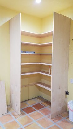 an empty room with some shelves in it